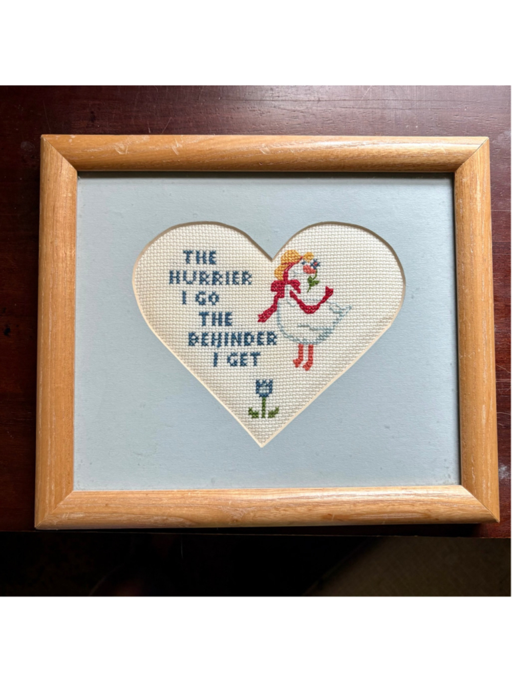 Vintage framed needlepoint with goose graphic